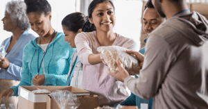 Volunteers handing out food to those in need