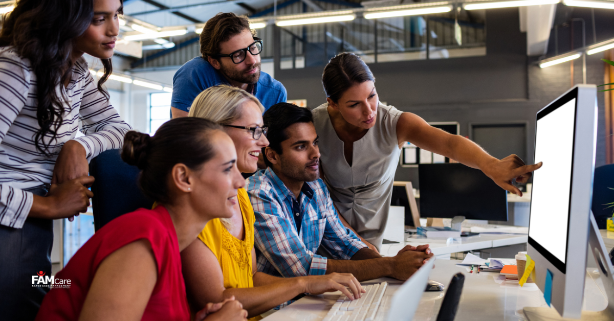 Government workers working with case management software 