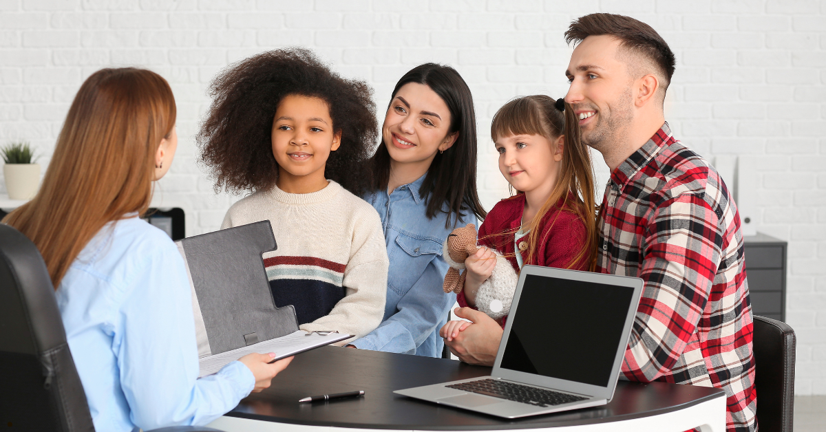 A family case manager reviewing a care plan with a parent, offering guidance and support to navigate complex family challenges.