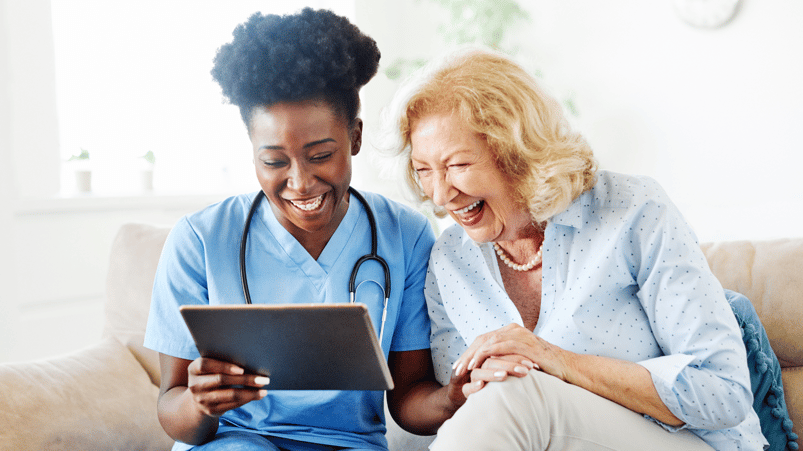 Social worker using senior care management solutions to benefit senior 