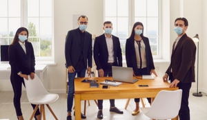 social workers with masks on in meeting
