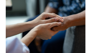 Adult Services Specialist helping elderly patient 