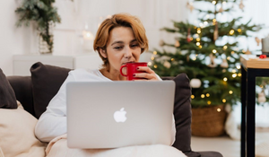 A caseworker working from home with a Christmas tree in the background 