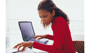 A Caseworker working on a laptop