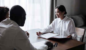 Social worker smiling at clients 