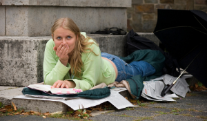 homeless student trying to do homework